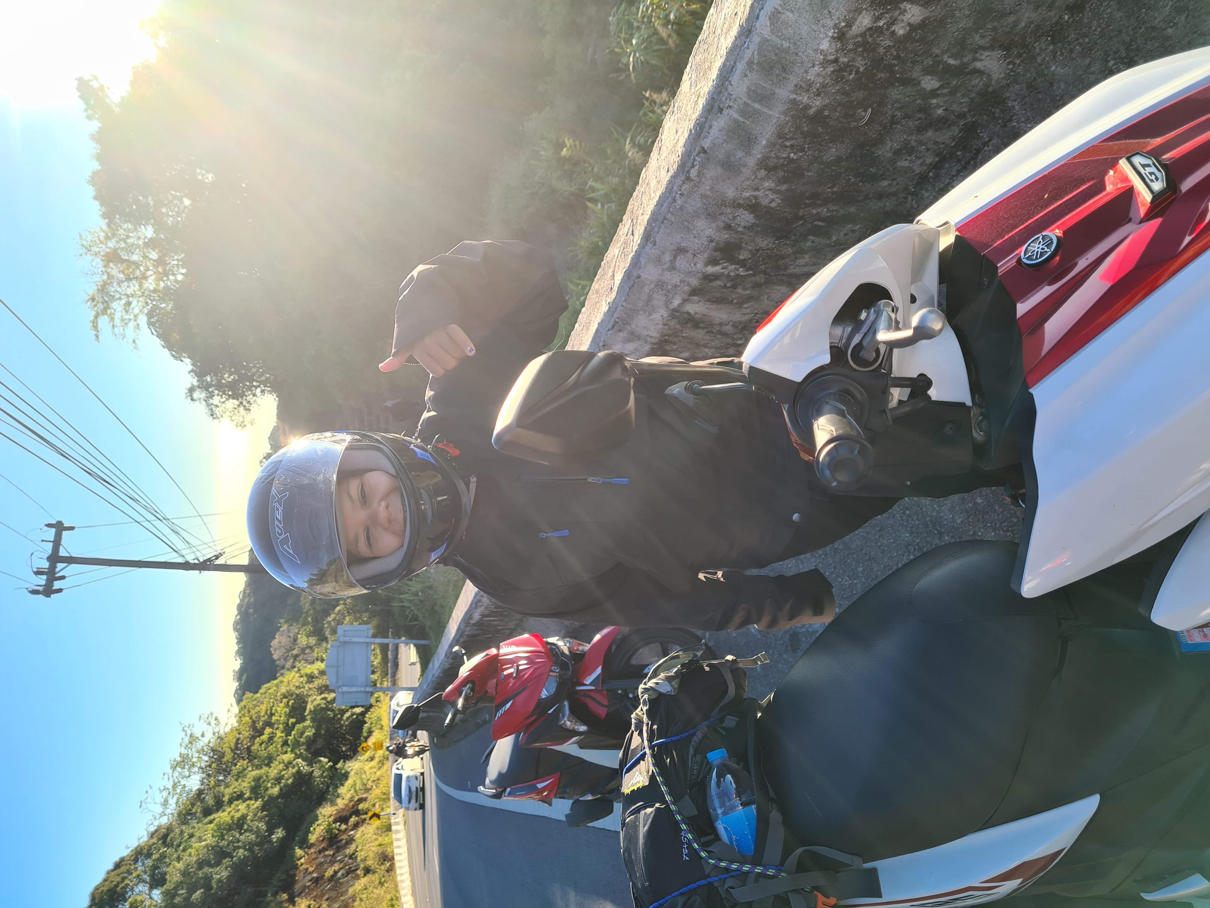 Motorbike loaded with bags and helmets for a trip in Thailand