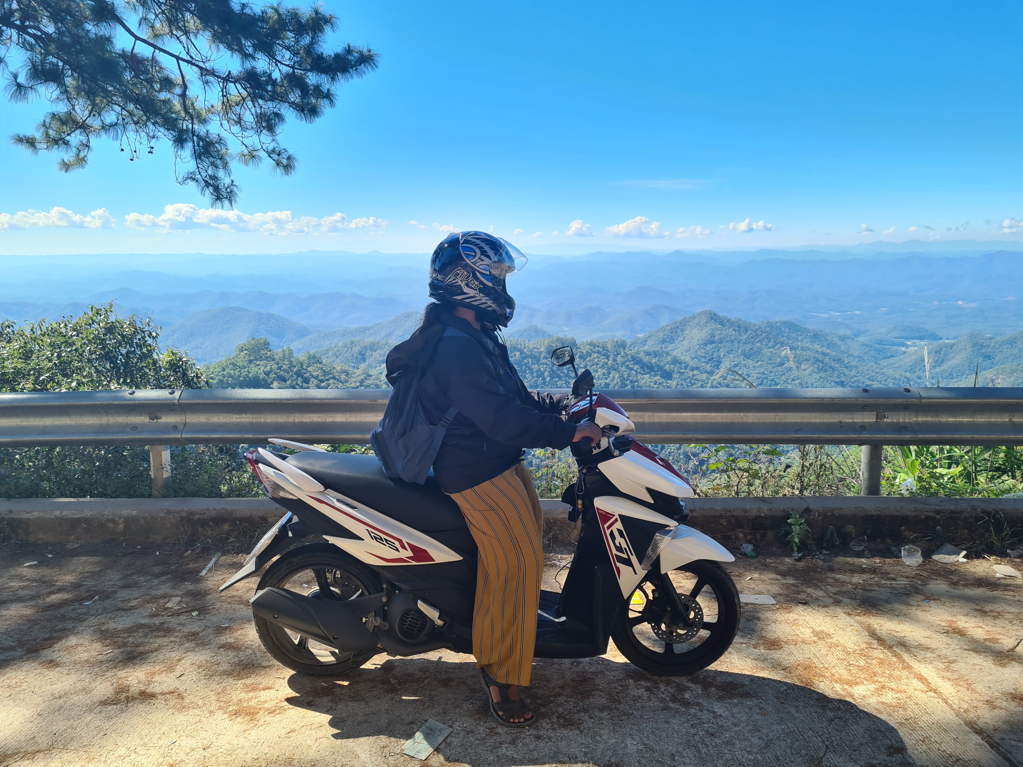 Nana on a motorbike during a trip while working full time in Thailand