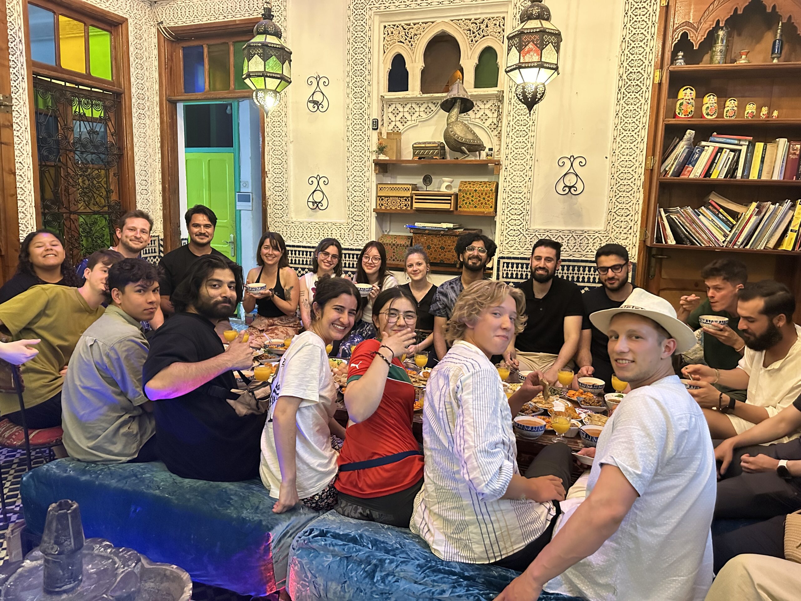 Large international group sharing a meal together in Morocco