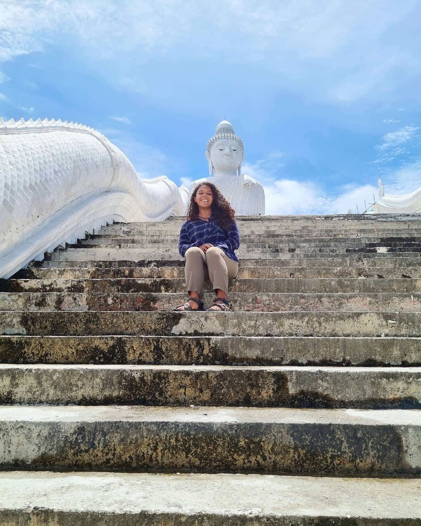 Nana sitting on the steps at Big Buddha in Phuket in 2020 with almost no visitors around