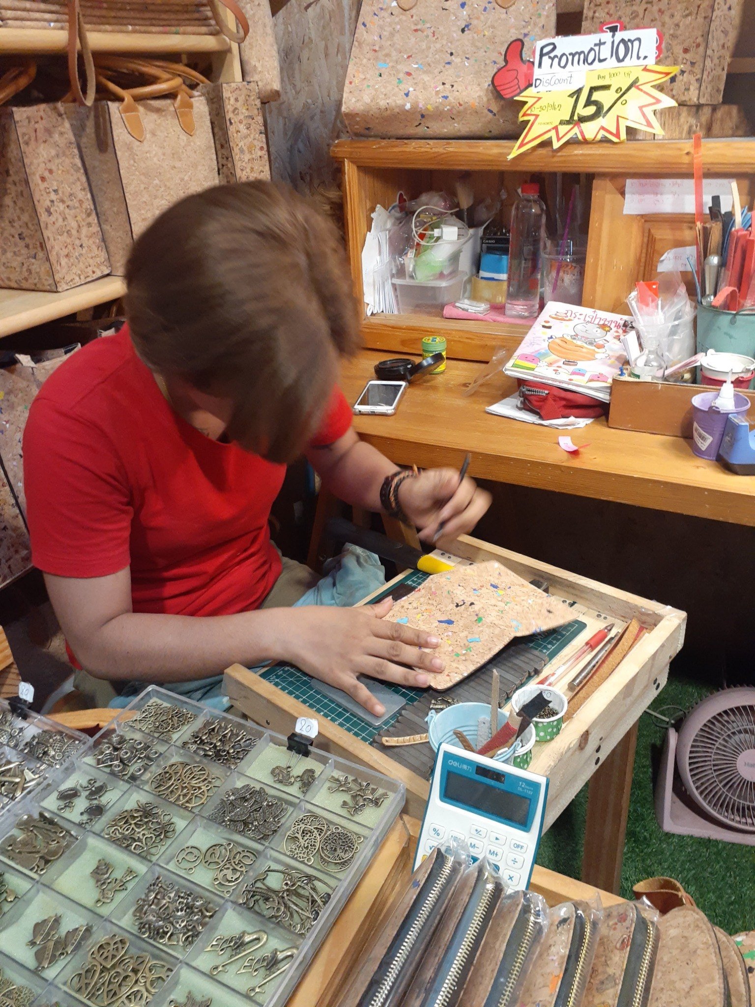 Craftsperson working by hand at a shop in Phuket Town in 2019