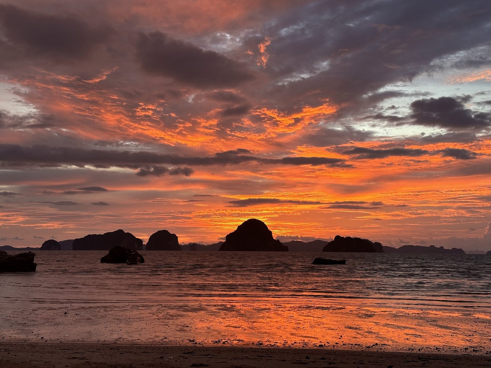 Fiery orange sunset over the sea in southern Thailand after a teaching work day