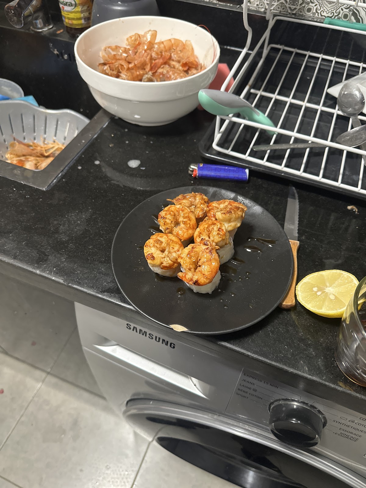Two people preparing food together in a home kitchen